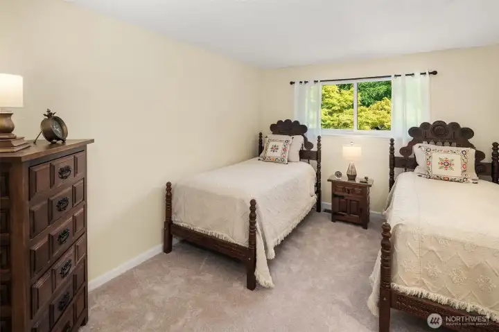 Second north-facing bedroom with fresh carpet and paint.