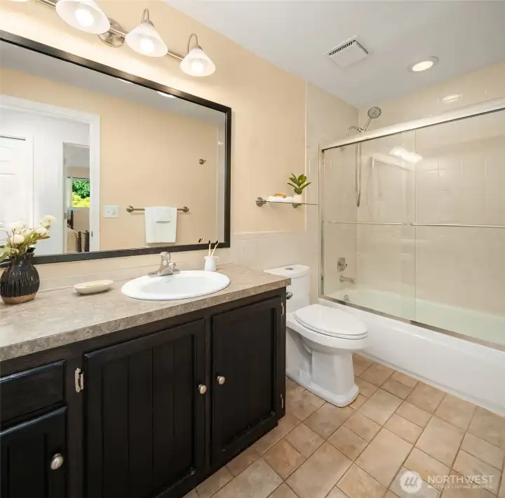 Secondary full bath on bedroom level.