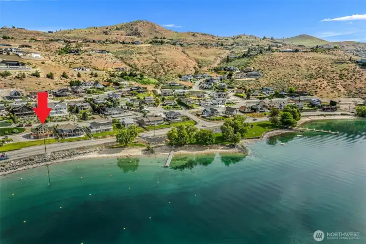 This Chelan Hills community waterfront home is steps away from the expansive members-only Willows park, where swimming, volleyball, boating and all things water-related await!