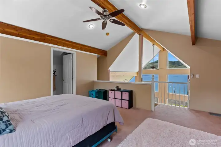 Lake Chelan and mountain views get even better from the upper level guest bedroom suite