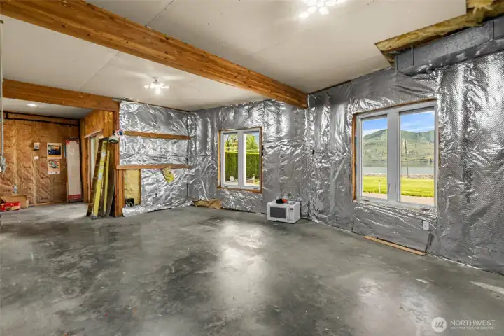 The lower level is unfinished and just waiting to be completed to meet your needs.