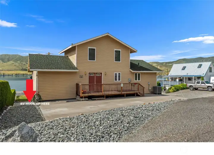 RV hook up with water, power & sewer in front of home