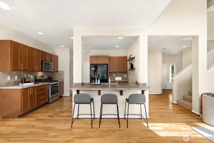 Kitchen and breakfast bar. Main entry to right.