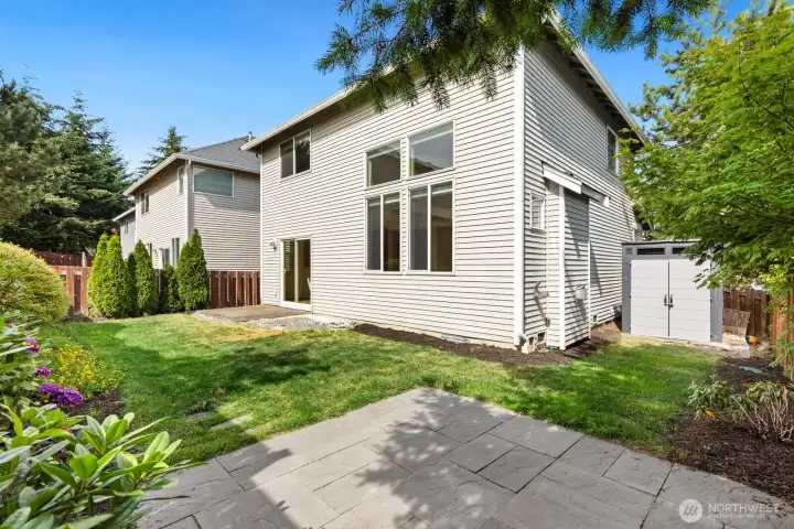 Backyard is great for enjoying summer evenings. Shed stays with property!