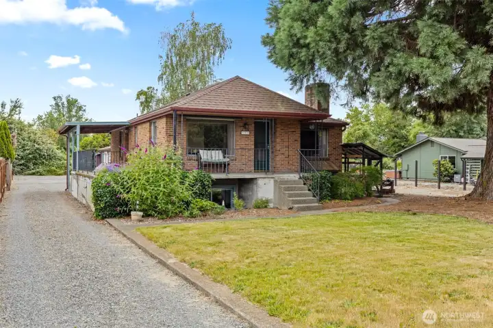 Large front and back yards on this private Puyallup property!