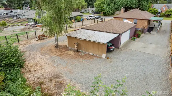 Aerial view of the carport, shop/garage and property