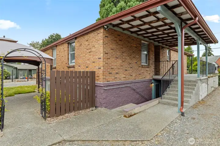 A view from the side patio + lower floor exterior entrance