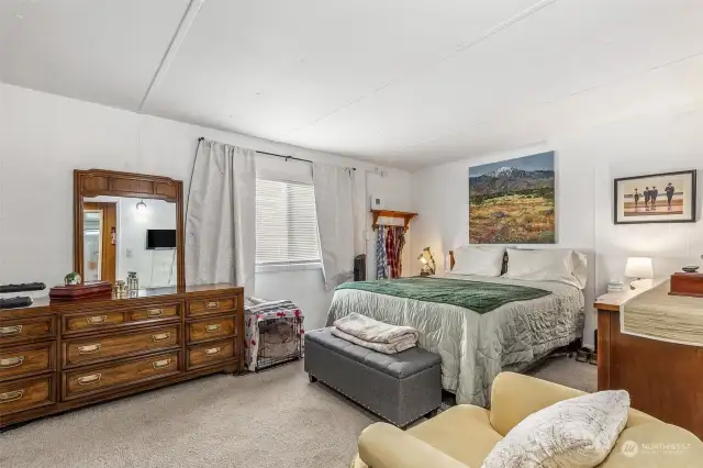 Large, spacious primary bedroom with large closet.