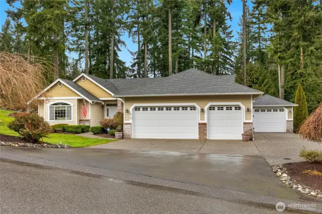 Here's the rambler you've been looking for. Great neighborhood of Estate sized homes all on 1 acre lots, ( DEEDED LAND) minutes west of I-5 off 116th St exit. Approx. 2450 sq ft with over 1100 sq ft of garage space. 4th garage is heated, would make a nice workshop or craft room.  Natural gas heat & H20, 4 bdrm septic system was just pumped, formal living & dining rooms, spacious Great room, 4th bedroom could be a home office or Den. Primary suite has a 5 piece bath, walk-in closet and vaulted ceilings. Beautifully landscaped corner lot. Backyard has a water feature, covered deck and outbuilding for tools, mowers or potting. Sprinkler system front & back. Gutters with leaf guard for easy maintenance. Invisible electric dog fence around the perimeter of the lot, no need to fence. Several playground areas for the small ones. Minutes to I-5, Costco, Outlet Mall, Tulalip Casino and restaurants.