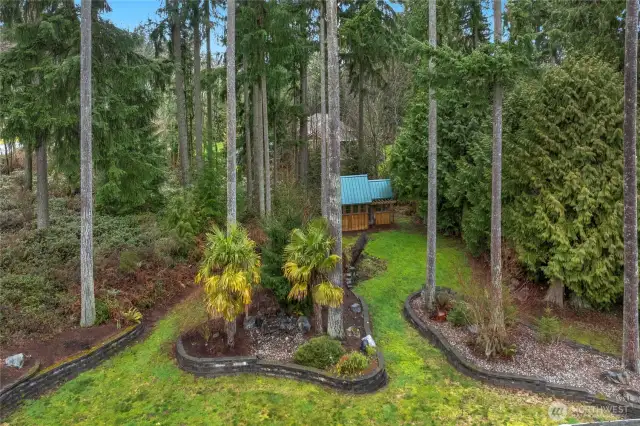 Aerial drone view looking over the top of the home to your private backyard.