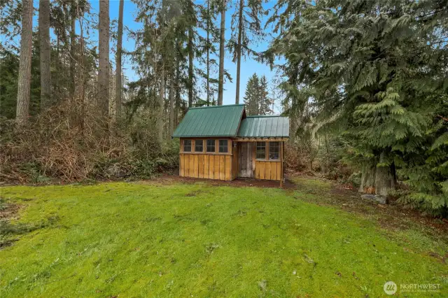 This greenhouse/shed has power and a barn door to access the back of it to put your riding lawn mower and other tools in. Outbuilding has the controls for the Invisible electric fence to keep your pets in the yard.