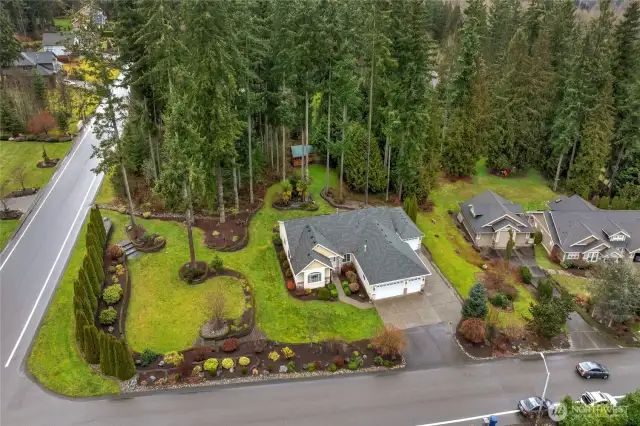 Corner lot allows lots of space from neighbors as does the 1 acre homesite. You can see the Greenhouse/storage shed to the rear of the backyard. Natural gas in this neighborhood and high speed internet in case you work from home.