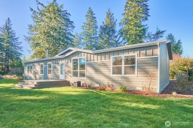 Like-new home on acreage with shop space galore!