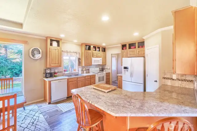 Kitchen leads to mud/utility room and back door