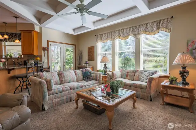 Kitchen Bar and Family Room With Gas Fireplace and French Doors.