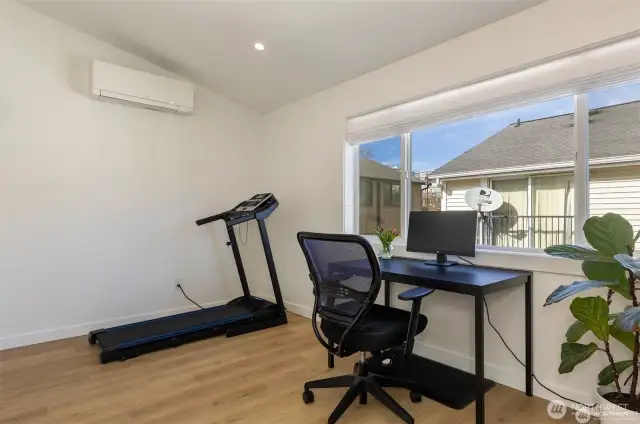 Second bedroom upstairs used as office and gym