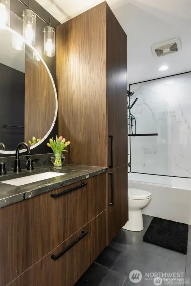 Lower floor bathroom with gorgeous cabinets and heated floors.