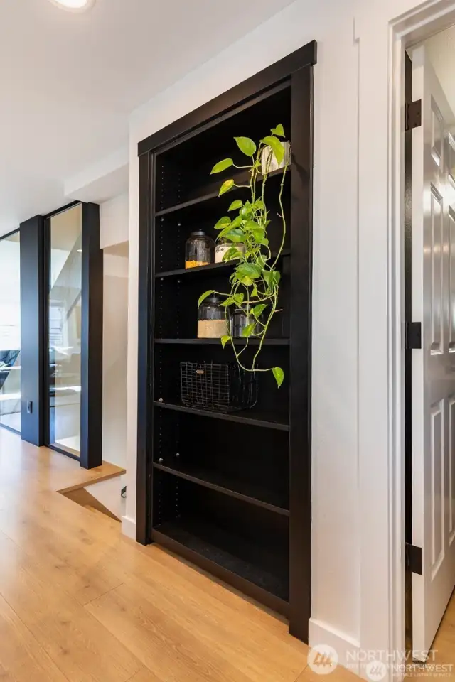 Pantry is hidden behind a bookshelf