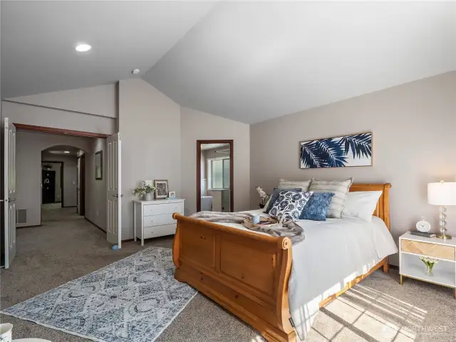 The primary bedroom suite is one of the highlights in this meticulously cared for home...double-door entry, vaulted ceilings, and 5-piece ensuite bath.