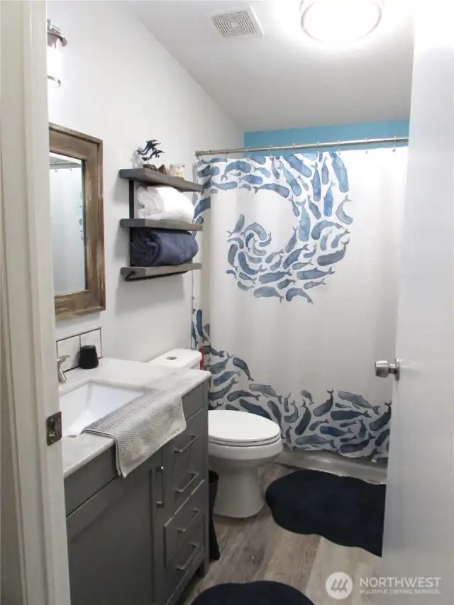 Updated flooring, vanity & decor.