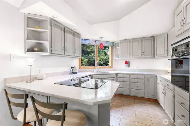 This thoughtfully laid out kitchen includes abundant cabinetry and countertop space for effortless cooking and entertaining.