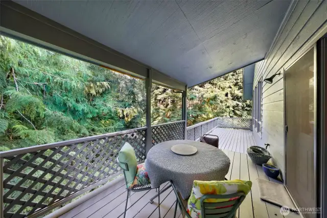 Enjoy year-round outdoor living on the covered portion of the expansive wraparound deck