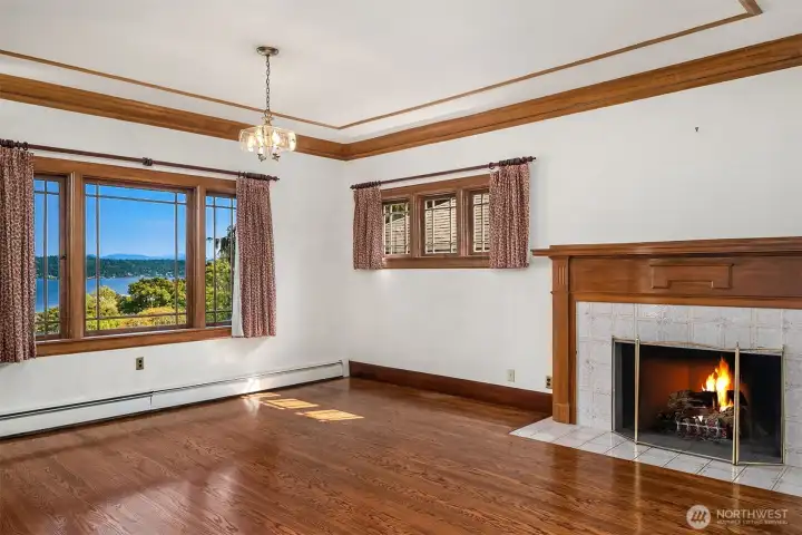 Primary bedroom with fireplace and gorgeous views of the lake.