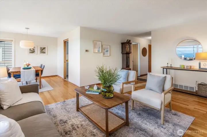 The open layout flows from the Living Room into the Dining area.
