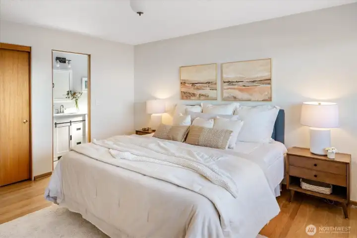 The primary bedroom features two closet areas and a half-bath.