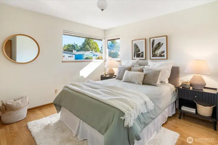 This corner bedroom on the main floor is also so spacious & inviting.