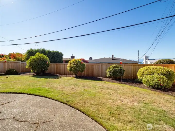 The new wood fence makes the backyard terrific and the level grassy area is well done.