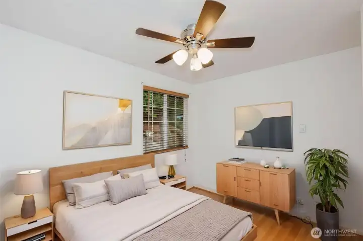 Virtually staged bedroom in hallway next to main bathroom