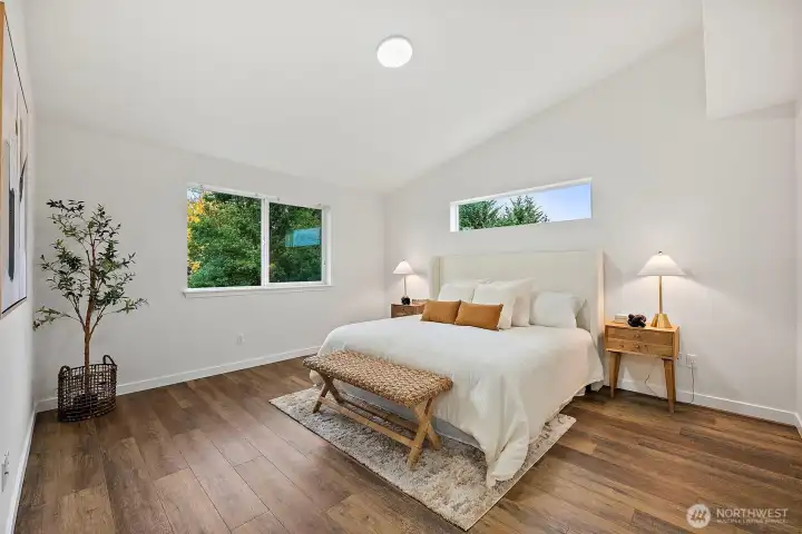 Primary room is a SUITE! Vaulted ceilings, bright window light, retreat in peace and rest