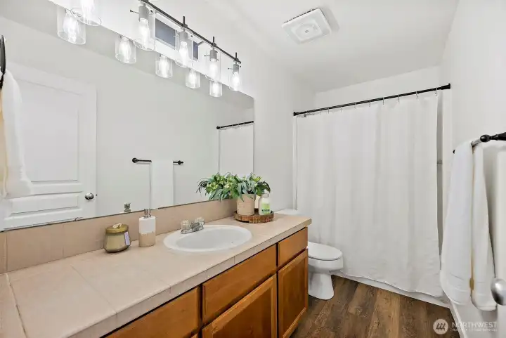 Full bathroom upstairs, generous countertop space, loads of storage space, easy care floors again