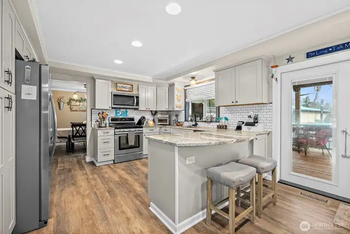 Gorgeous granite countertops throughout the Kitchen with an eat-at bar.