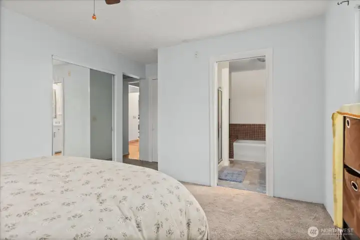 Abundant closet space including a walk-in closet  features, a private primary bathroom.