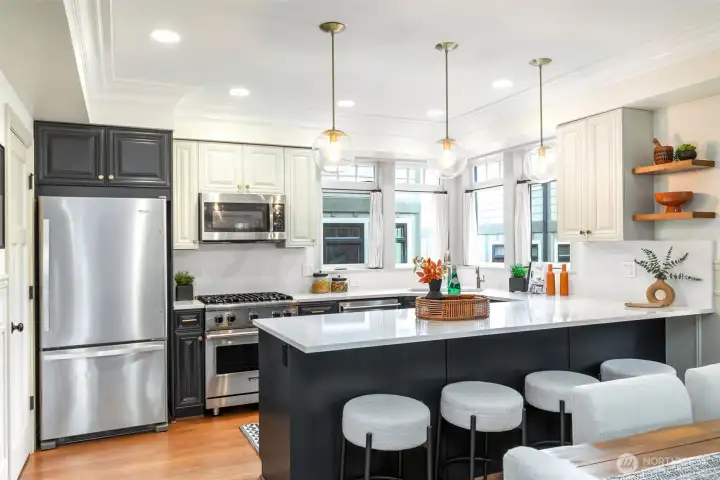 Fabulous Kitchen has been updated with newer counters, backsplash, painted cabinets and newer appliances.