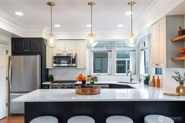 Fabulous Kitchen has been updated with newer counters, backsplash, painted cabinets and newer appliances.