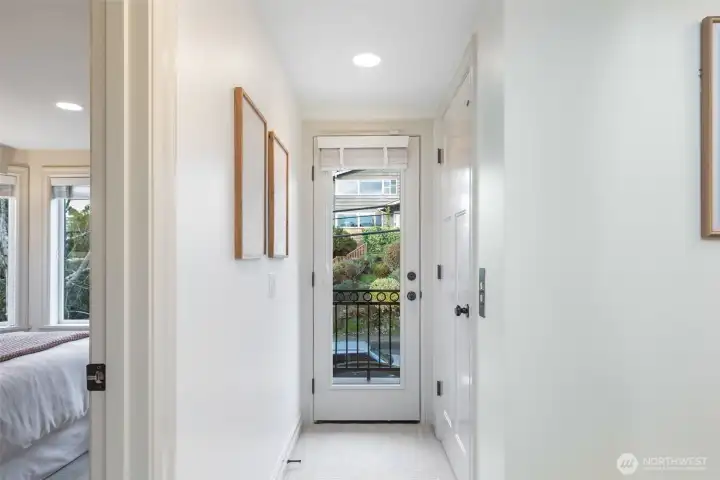 2nd floor has a deck overlooking Kinnear, plus two bedrooms, a large bath, laundry room and elevator access.