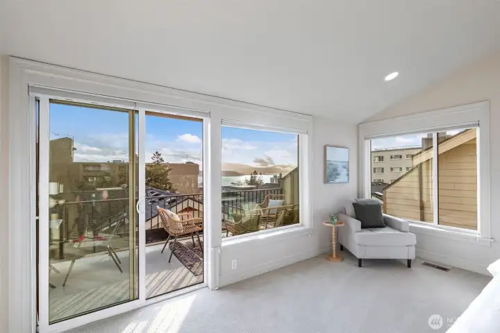 Primary bedroom on the top floor has great views of the puget sound and Mt Rainier.