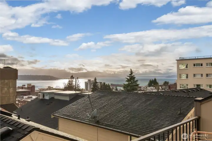 Primary bedroom on the top floor has great views of the Puget Sound and Mt Rainier.