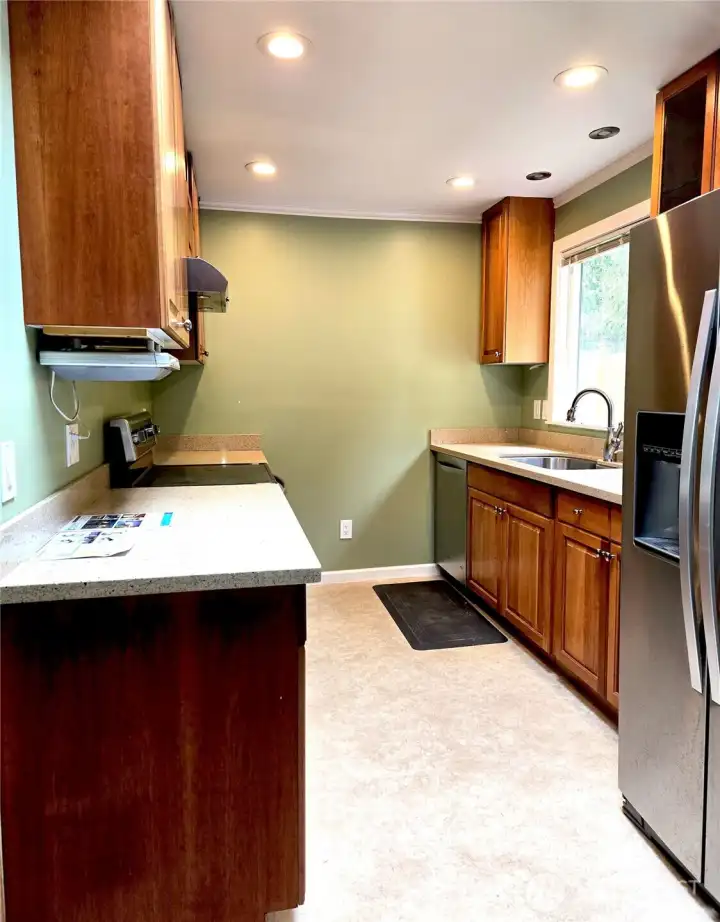 Updated kitchen with quartz countertops.