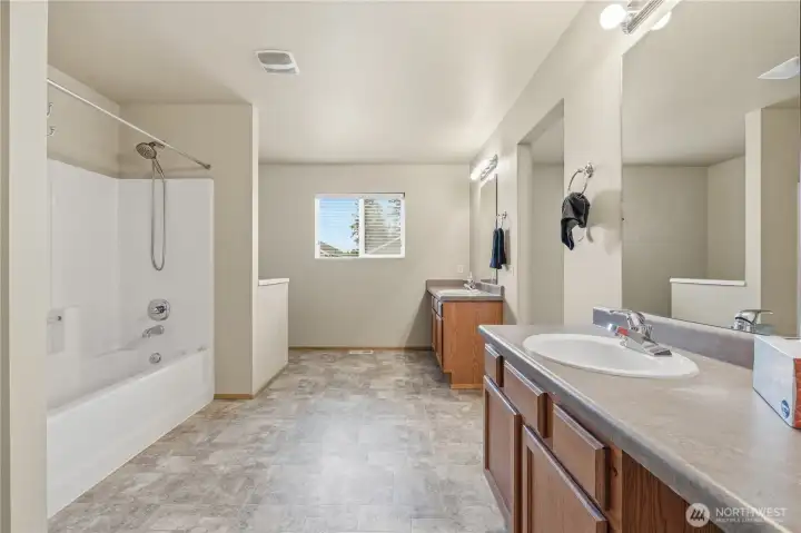 Private primary bath with dual vanities.
