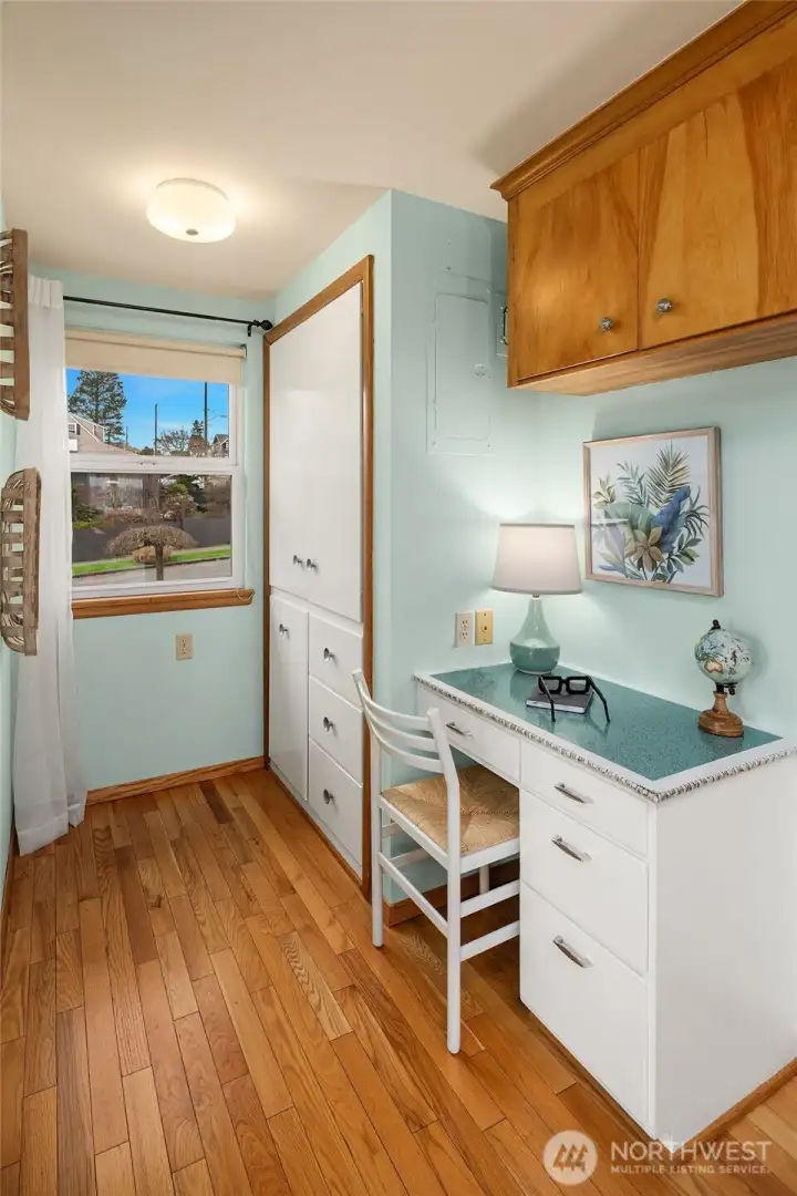 Convenient desk and storage off of the kitchen.