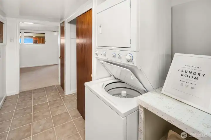 Laundry area on Lower Level between Bedroom and Bathroom. Good storage too.