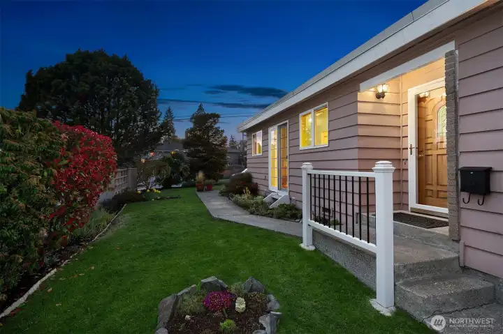 Looking west along south side of lot. Front entrance on the right.