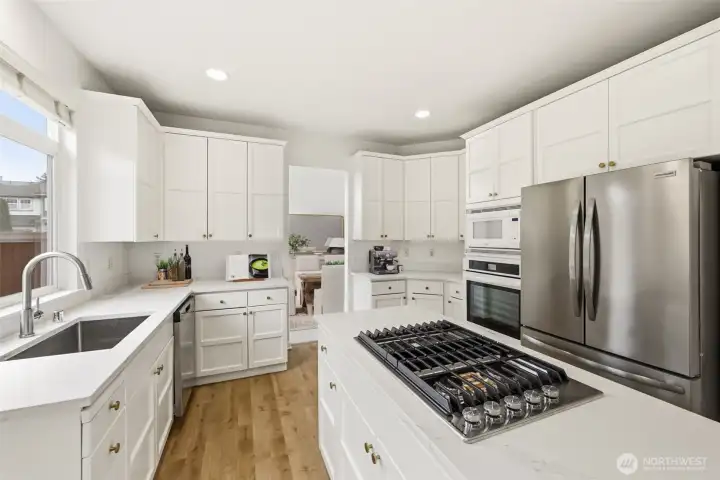 Spacious chef’s kitchen with abundant cabinetry and prep space