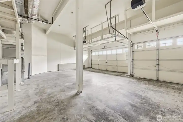 Rare three-car garage with abundant storage and workspace