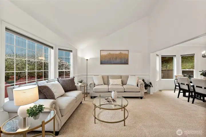 Formal living room with ample lighting and new paint