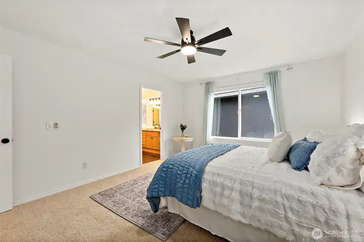 Primary bedroom with attached five piece bathroom